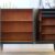skap-656.5_f Sideboard Teak schwarz mit Goldrahmen – 1960er